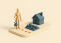 Maquette d un retraite avec un arrosoir devant un jardin et une maison, jetons oranges au sol